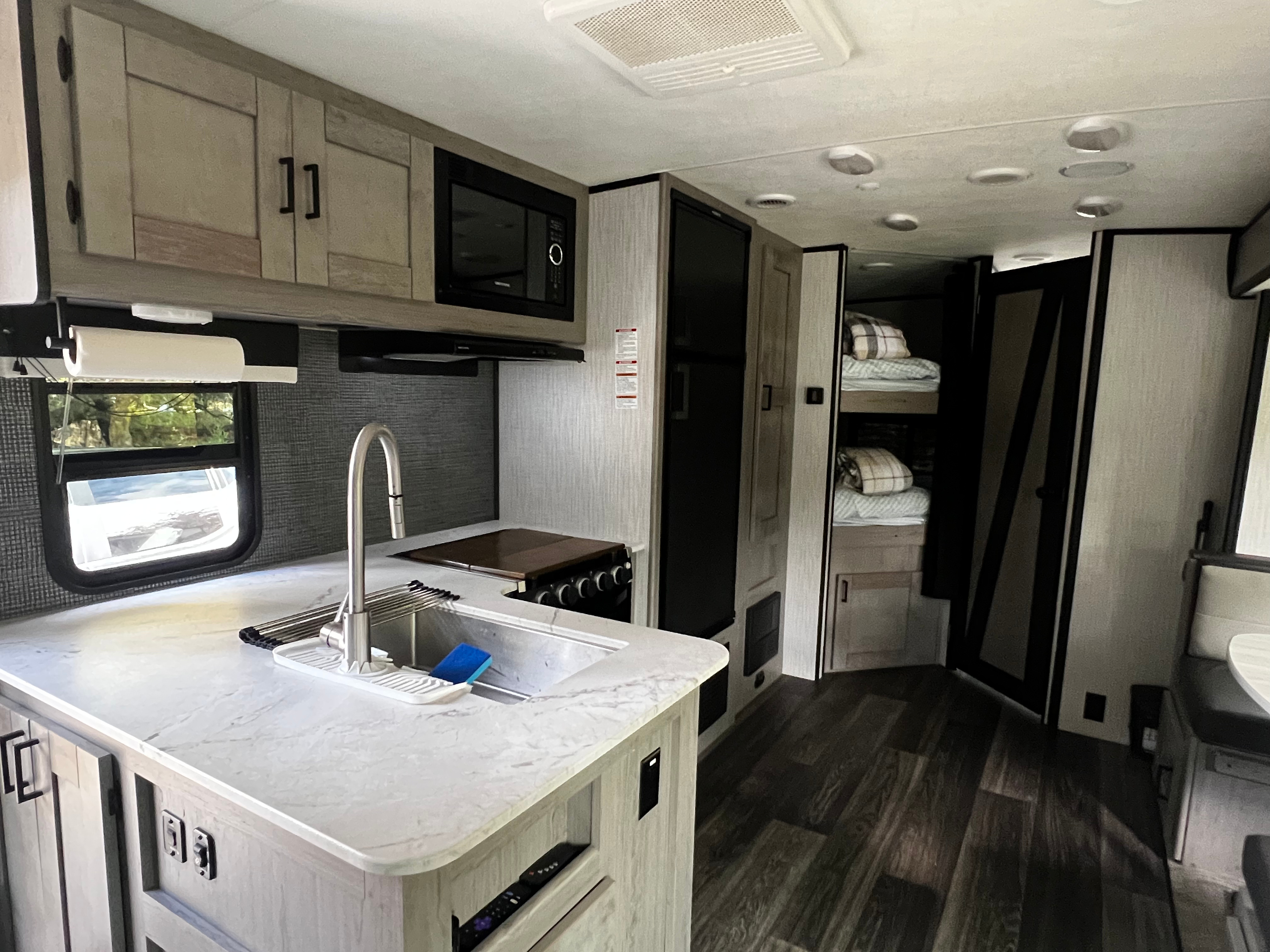 Kitchen with 3-burner cooktop and oven